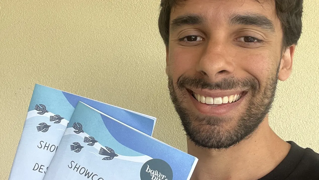 Sav Tripodi with two booklets from the Bowerbird market.